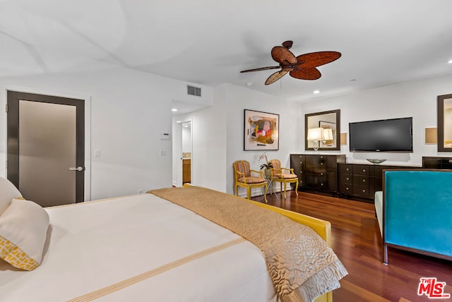 bedroom with ceiling fan and dark hardwood / wood-style flooring