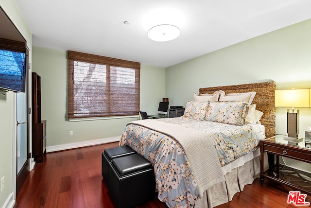 bedroom featuring dark hardwood / wood-style floors