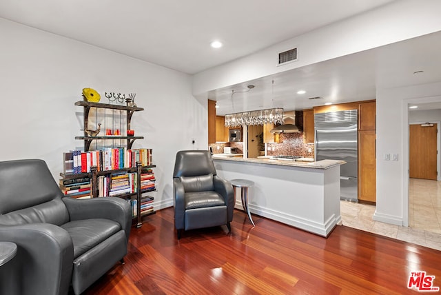 sitting room with dark hardwood / wood-style floors