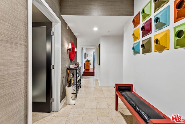 corridor with light tile patterned flooring