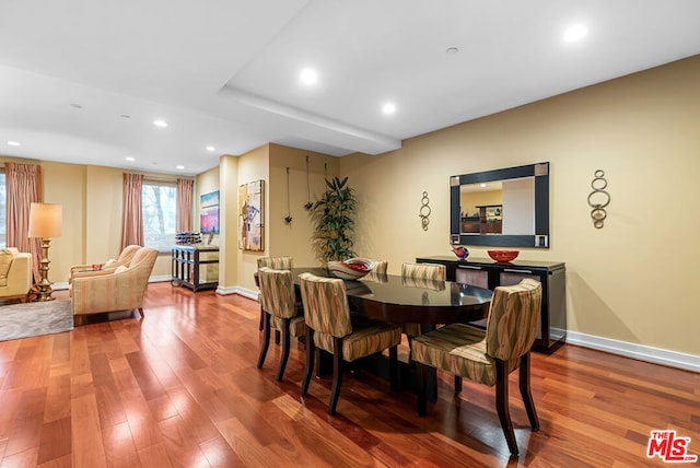 dining area with hardwood / wood-style flooring