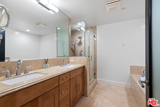 bathroom with independent shower and bath, tile patterned flooring, and vanity