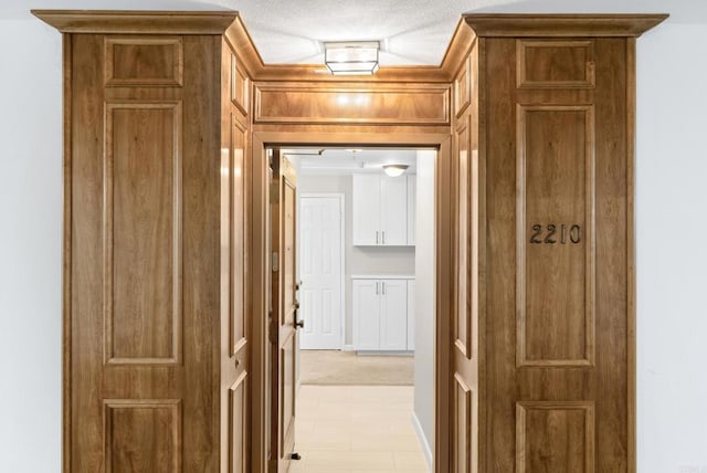 hallway featuring a textured ceiling