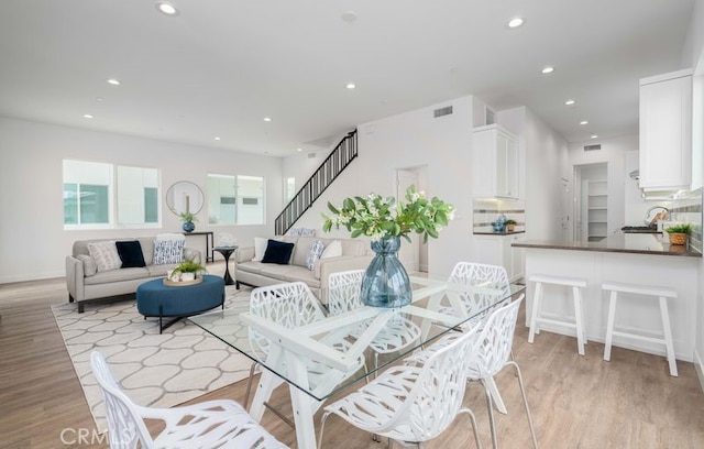 living room with light hardwood / wood-style flooring