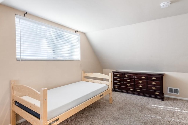 carpeted bedroom featuring vaulted ceiling