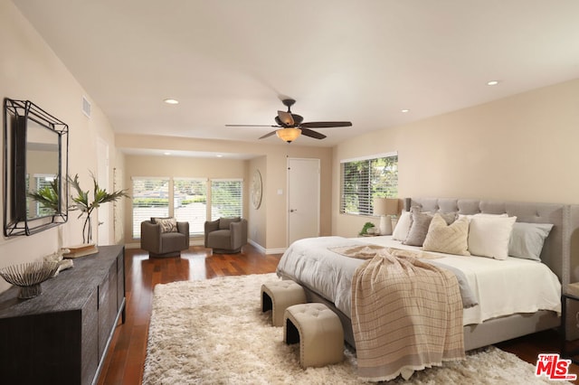 bedroom with ceiling fan and dark wood-type flooring