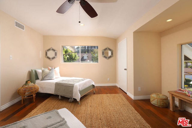 bedroom featuring ceiling fan and dark wood-type flooring