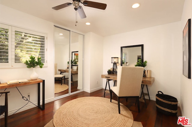 office with ceiling fan and dark hardwood / wood-style flooring