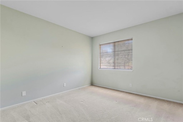 empty room with light colored carpet