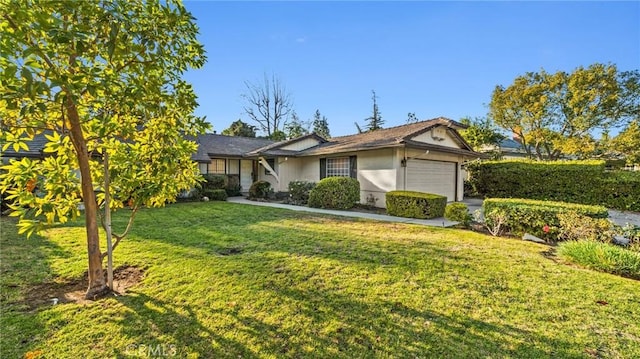 single story home with a front lawn and a garage