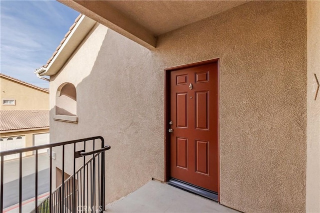 doorway to property featuring a balcony