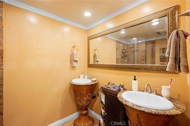 bathroom featuring walk in shower, crown molding, and vanity