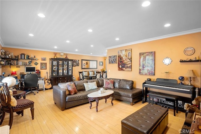 living room with light wood-type flooring and crown molding