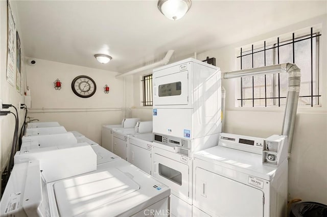 washroom with separate washer and dryer and stacked washer and clothes dryer