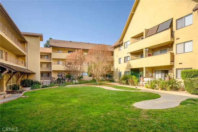 view of home's community featuring a lawn