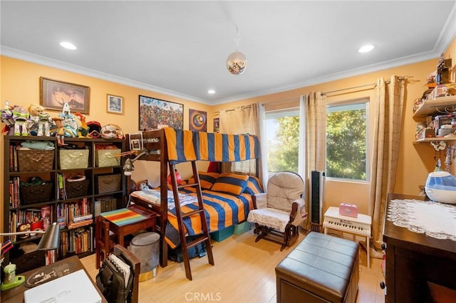 bedroom featuring light hardwood / wood-style flooring and crown molding