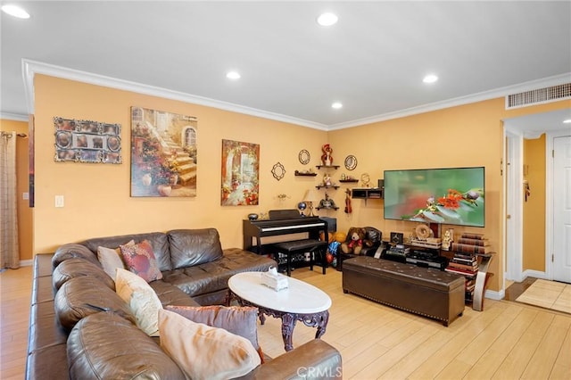 living room with light hardwood / wood-style flooring and ornamental molding