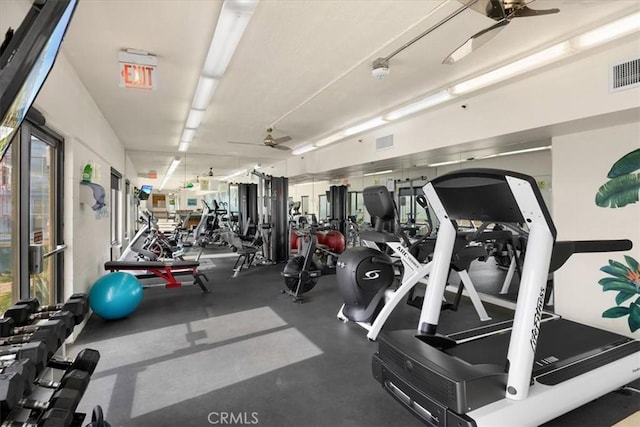 exercise room with ceiling fan