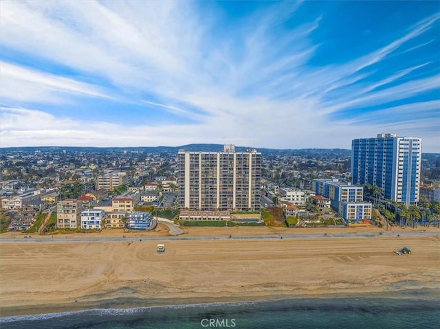 drone / aerial view featuring a view of the beach and a water view