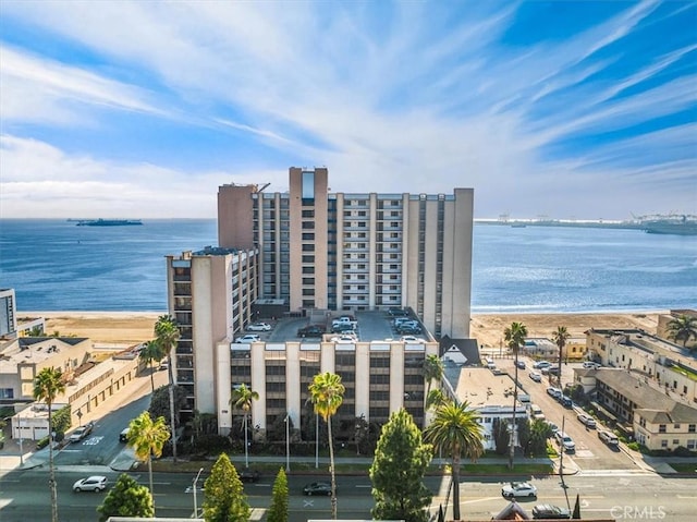 drone / aerial view with a water view and a view of the beach