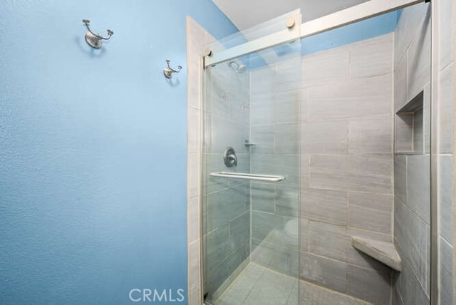 bathroom featuring walk in shower