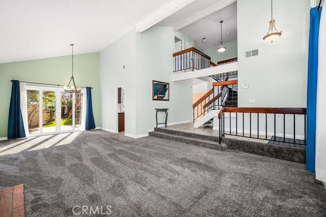 carpeted living room featuring high vaulted ceiling