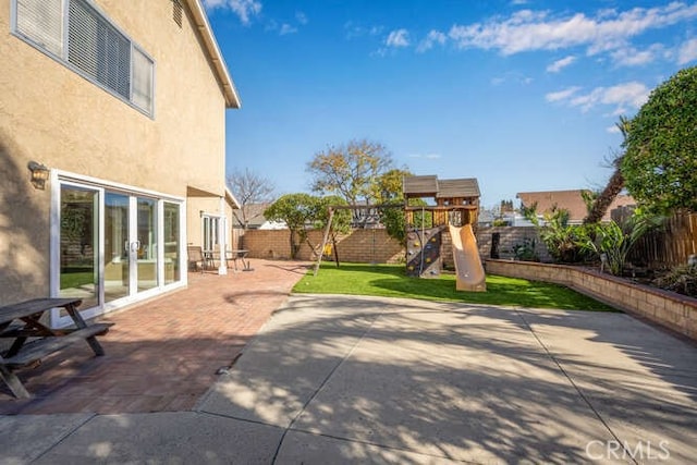 view of patio / terrace featuring french doors and a playground