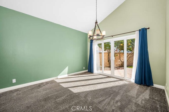 unfurnished room featuring carpet floors, high vaulted ceiling, and a chandelier