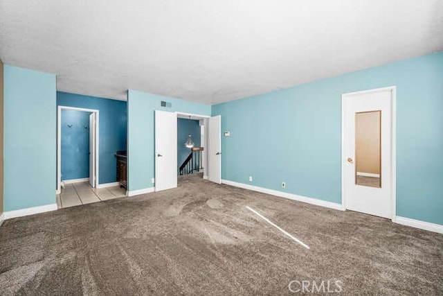 unfurnished bedroom featuring light colored carpet