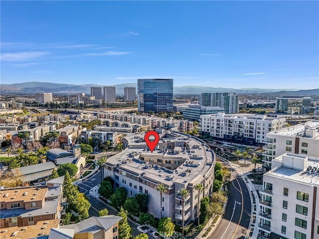 birds eye view of property featuring a mountain view