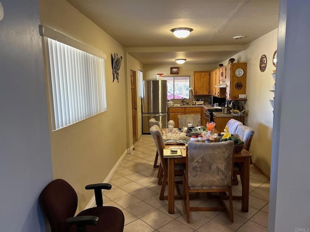 tiled dining space with sink