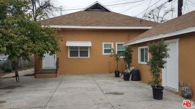 view of side of home featuring a patio area