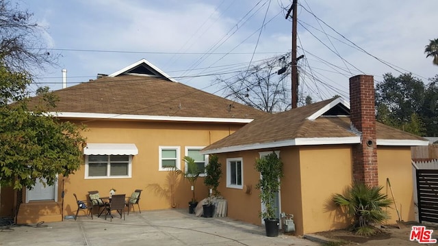 rear view of property featuring a patio