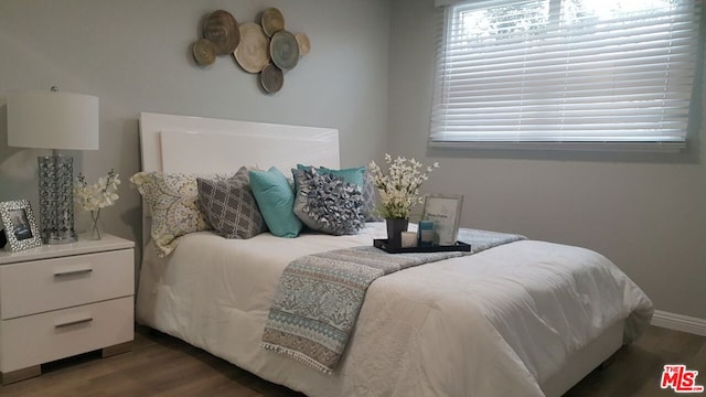 bedroom featuring dark wood-type flooring