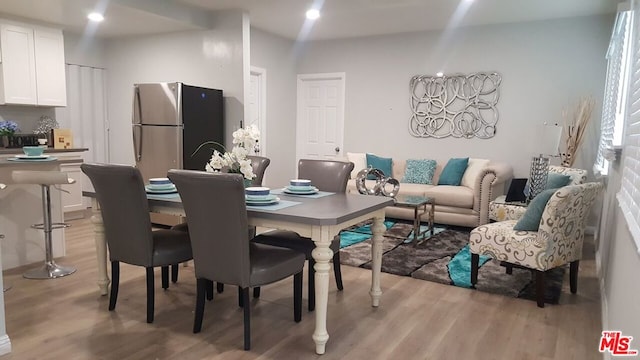 dining area with light hardwood / wood-style floors