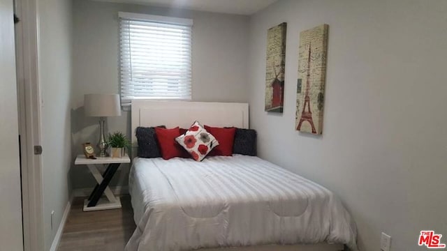 bedroom featuring hardwood / wood-style flooring