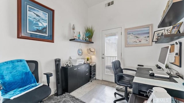 carpeted home office featuring visible vents