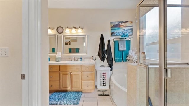 bathroom with a stall shower, tile patterned flooring, vanity, and a bath