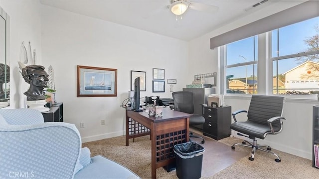 office with light carpet, a ceiling fan, visible vents, and baseboards