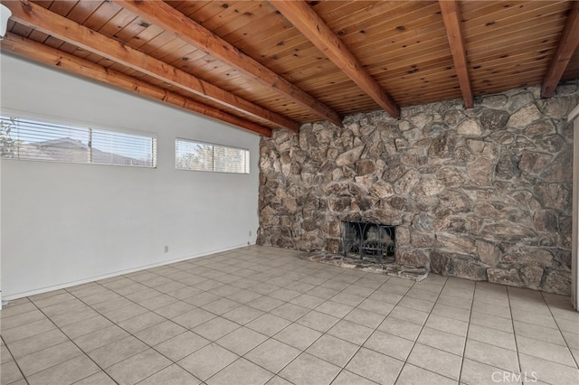 unfurnished living room featuring light tile patterned floors, wood ceiling, a fireplace, and vaulted ceiling with beams