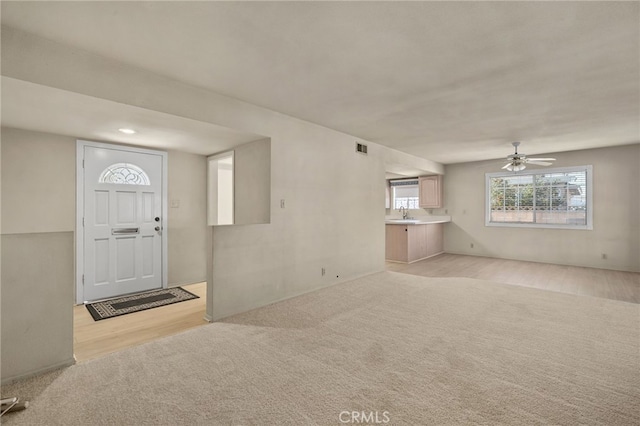 entrance foyer featuring ceiling fan