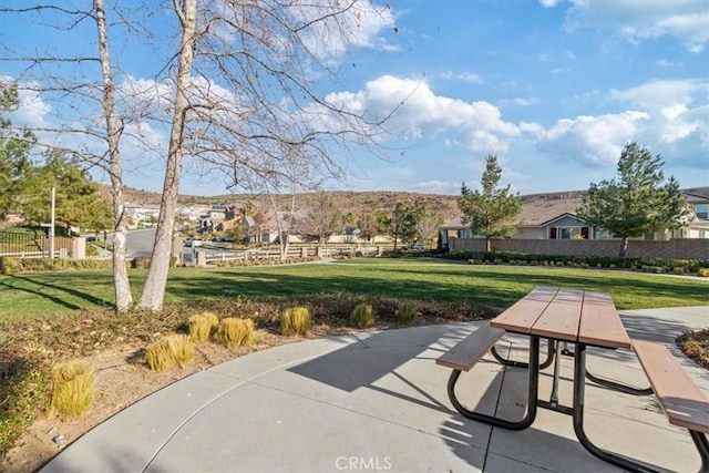 view of community with a patio and a yard