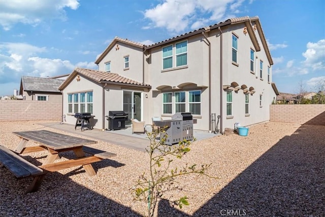 rear view of house featuring a patio area