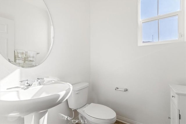 bathroom with toilet and sink