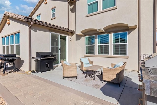 view of patio / terrace featuring outdoor lounge area and area for grilling