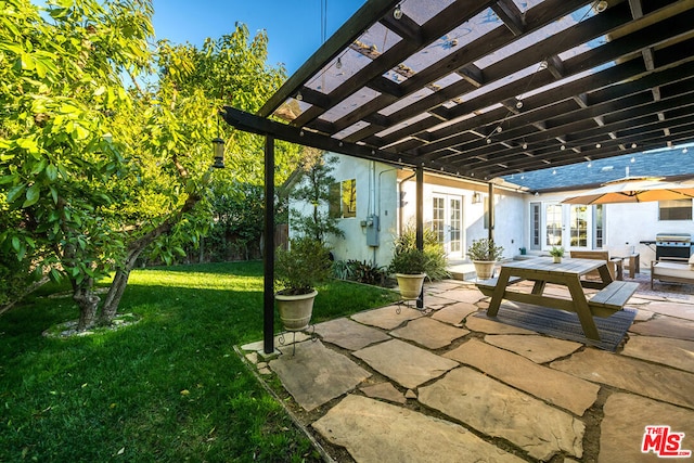 view of patio / terrace with grilling area, a pergola, and french doors