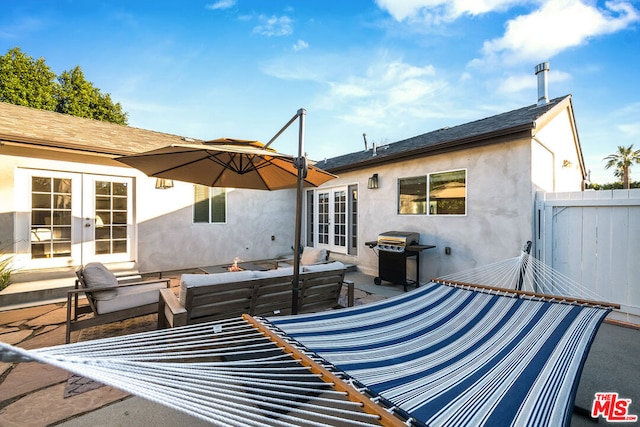 exterior space featuring french doors, an outdoor living space, and a patio