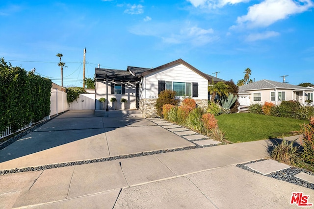 ranch-style house with a front lawn