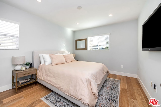 bedroom with light wood-type flooring