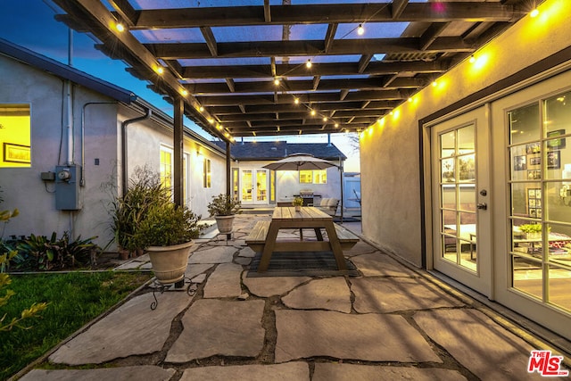 view of patio featuring grilling area, french doors, and a pergola